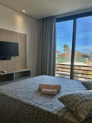 Uma cama ou camas num quarto em CASA ALTO PADRÃO BEIRA MAR AO LADO DO Zorah Beach Trairi - Flecheiras