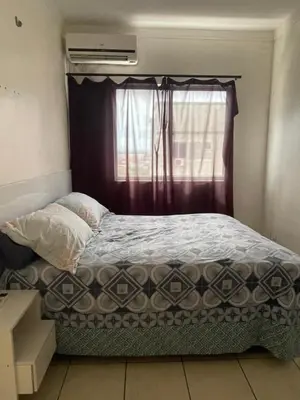 Uma cama ou camas num quarto em Apartamento Familia LL