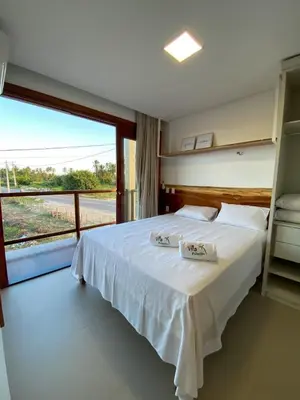 Uma cama ou camas num quarto em Villa Palmeira Flecheiras 202