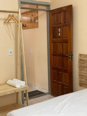 Uma cama ou camas num quarto em Pousada perto do mar