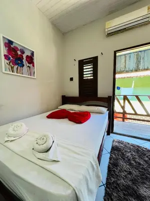 Uma cama ou camas num quarto em Pousada Praiana Jericoacora