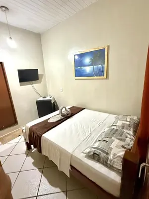 Uma cama ou camas num quarto em Pousada Praiana Jericoacora