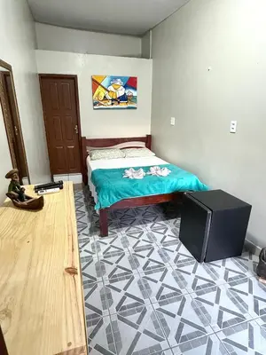 Uma cama ou camas num quarto em Pousada Praiana Jericoacora