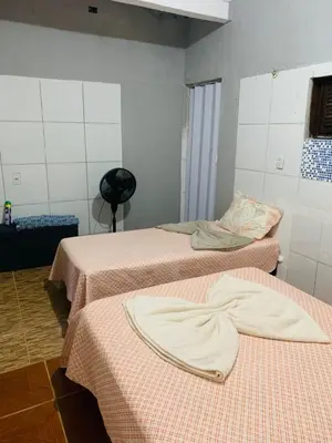 Uma cama ou camas num quarto em Recanto tia tonha