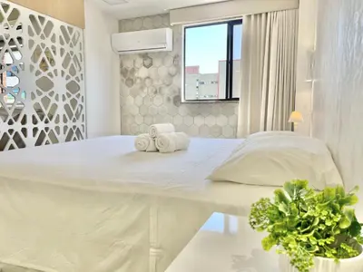 Uma cama ou camas num quarto em Aconchego à Beira Mar (no melhor do Meireles)