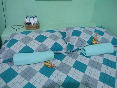 Uma cama ou camas num quarto em Casa Laranja