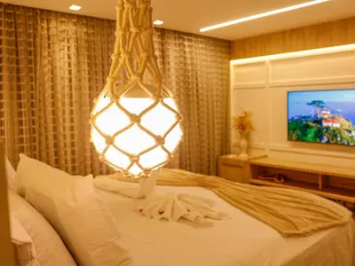 Uma cama ou camas num quarto em Bangalô Cobertura 4 suítes capacidade 14 pessoas