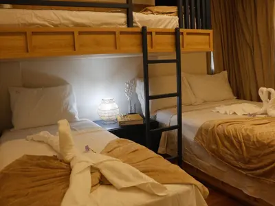 Uma cama ou camas num quarto em Bangalô Cobertura 4 suítes capacidade 14 pessoas