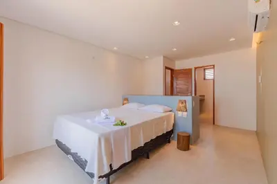 Uma cama ou camas num quarto em Casa LadoMar em Mundaú por Carpediem