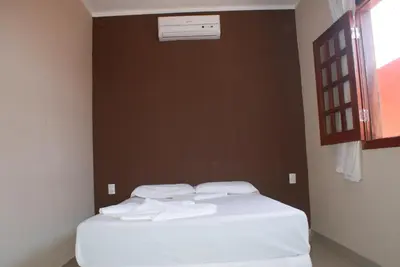 Uma cama ou camas num quarto em Flat La Fazenda