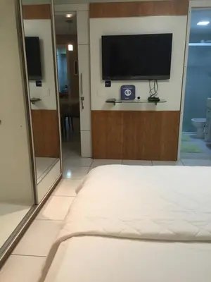 Uma cama ou camas num quarto em Homestay Fortaleza