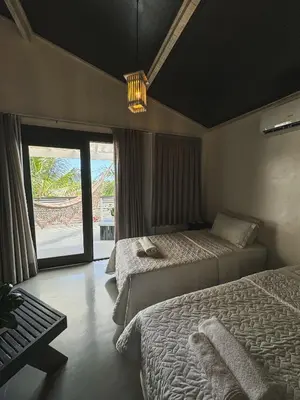 Uma cama ou camas num quarto em CHICO DINA POUSADA