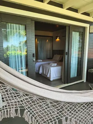 Uma cama ou camas num quarto em CHICO DINA POUSADA