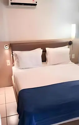 Uma cama ou camas num quarto em Apartamento em Beach Class Praia de Iracema Por CasAmarInn