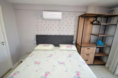 Uma cama ou camas num quarto em Fortaleza Rentals