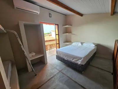 Uma cama ou camas num quarto em Vila das Pedras