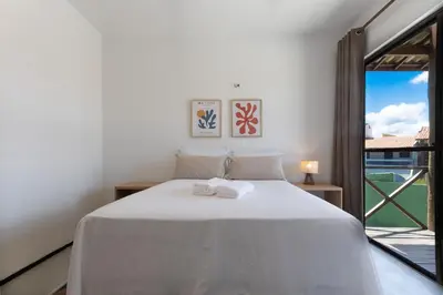 Uma cama ou camas num quarto em Beachfront Duplex #A10 em Barro Preto by Carpediem