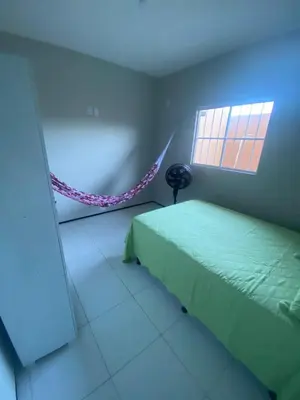 Uma cama ou camas num quarto em Portas do Morro Branco