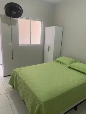 Uma cama ou camas num quarto em Portas do Morro Branco