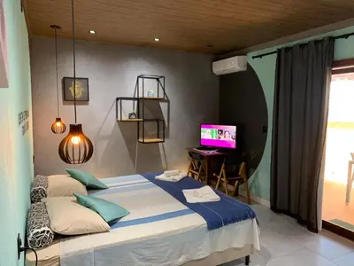 Uma cama ou camas num quarto em Pousada Villa Flamboyant