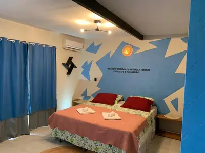 Uma cama ou camas num quarto em Pousada Villa Flamboyant