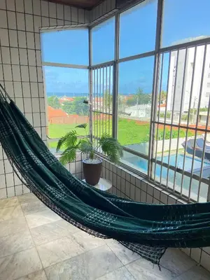 Um jardim no exterior de Apto exclusivo, 200m da praia, horario flexivel 24 horas