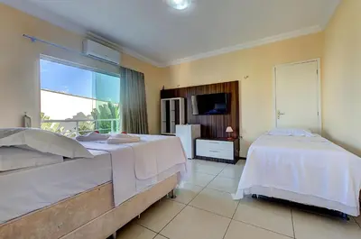 Uma cama ou camas num quarto em Casa Incrível na Praia de Tabuba by Carpediem
