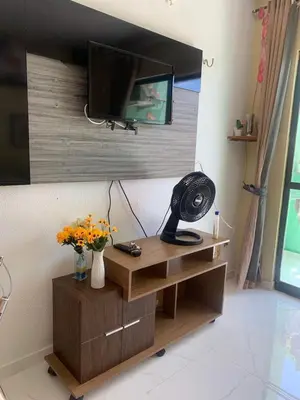 Uma televisão e/ou sistema de entretenimento em Apartmento Aquiraz - Crystal Park Flat