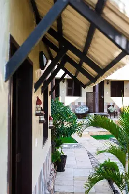 Um jardim no exterior de Pousada Mundial