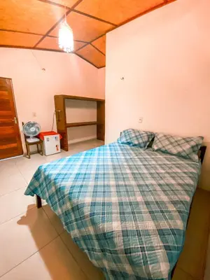 Uma cama ou camas num quarto em Flechimar Suítes