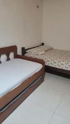 Uma cama ou camas num quarto em Flechimar Suítes