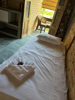 Uma cama ou camas num quarto em Pousada Sol Nascente