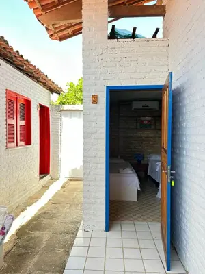 Uma cama ou camas num quarto em Pousada Sol Nascente