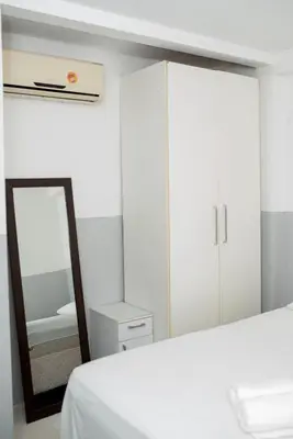 Uma cama ou camas num quarto em flat 202 Atlantico residence
