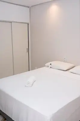 Uma cama ou camas num quarto em Flat atlantico 1301