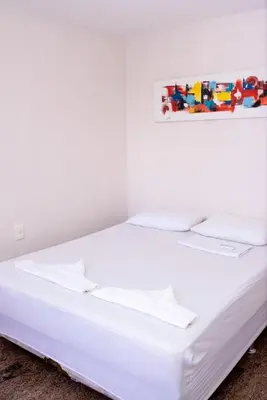 Uma cama ou camas num quarto em Flat atlantico 1601