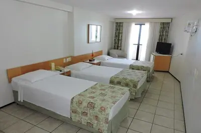 Uma cama ou camas num quarto em Iracema Travel