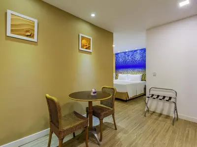 Uma cama ou camas num quarto em Mercure Fortaleza Meireles