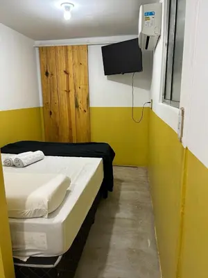 Uma cama ou camas num quarto em Tiny Lagoa