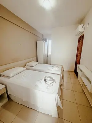 Uma cama ou camas num quarto em Kitecabana Apartamento