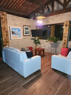 Uma área de estar em Vivenda Mar Doce Lar - Casa de Temporada