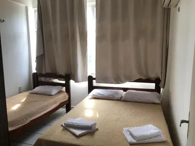Uma cama ou camas num quarto em Apartamento praia Beira Mar