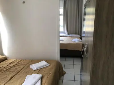 Uma cama ou camas num quarto em Apartamento praia Beira Mar