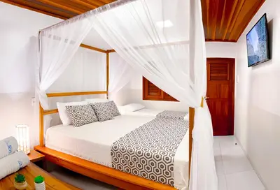 Uma cama ou camas num quarto em Rede Andrade Jeri Hotel
