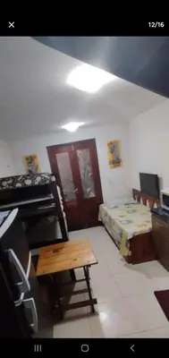 Uma televisão e/ou sistema de entretenimento em Triplex Solar Casa Branca 02