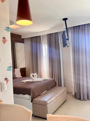 Uma cama ou camas num quarto em VG FUN Praia do Futuro Pé na Areia ap 311 IMOB TEMPORADA