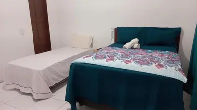 Uma cama ou camas num quarto em Pousada Vela dos Ventos