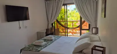Uma cama ou camas num quarto em Varandas do Mar pé na areia