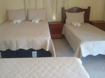 Uma cama ou camas num quarto em pousada marimar