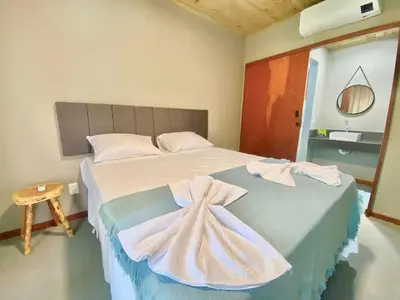Uma cama ou camas num quarto em Casa do Pier, bangalôs em Fortim c/ Café da Manhã